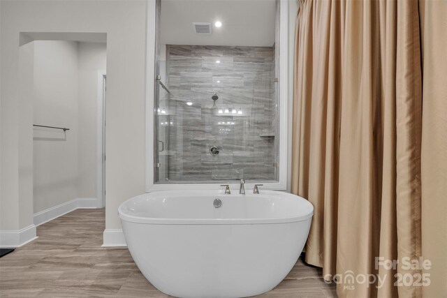 513 Meadow Ridge Dr, Belmont, NC 28012 - full bath featuring a freestanding bath, baseboards, a shower, and recessed lighting