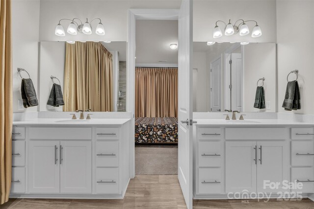 513 Meadow Ridge Dr, Belmont, NC 28012 - bathroom with two vanities and wood finished floors