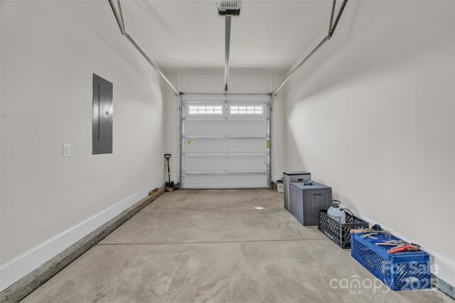 513 Meadow Ridge Dr, Belmont, NC 28012 - garage with electric panel, baseboards, and a garage door opener