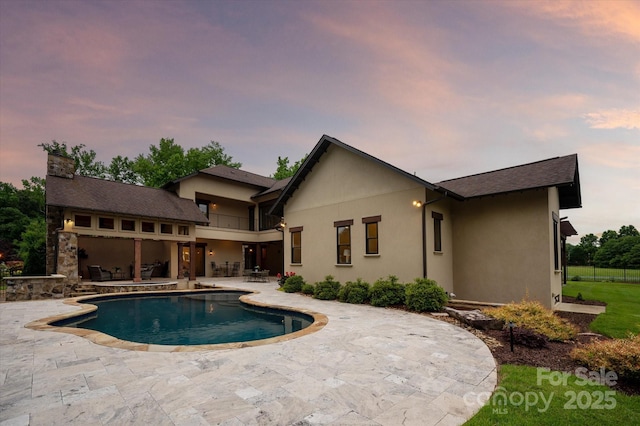 1501 Alydar Ct, Waxhaw, NC 28173 - pool at dusk featuring a patio area and an outdoor pool