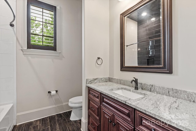 1501 Alydar Ct, Waxhaw, NC 28173 - full bathroom featuring baseboards, toilet, vanity, and wood finished floors