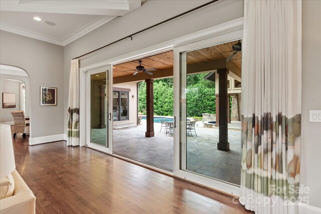 1501 Alydar Ct, Waxhaw, NC 28173 - doorway featuring ceiling fan, wood finished floors, crown molding, baseboards, and arched walkways