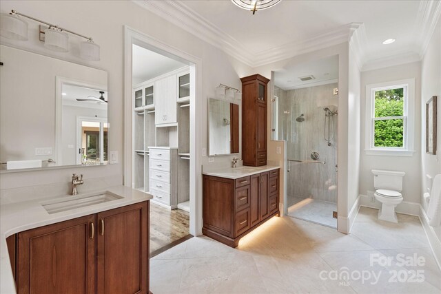 1501 Alydar Ct, Waxhaw, NC 28173 - full bath featuring a shower stall, ornamental molding, two vanities, tile patterned flooring, and toilet