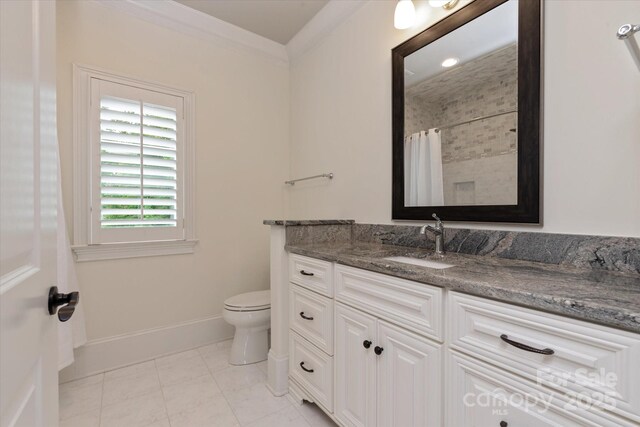 1501 Alydar Ct, Waxhaw, NC 28173 - bathroom featuring toilet, vanity, crown molding, baseboards, and a shower with shower curtain