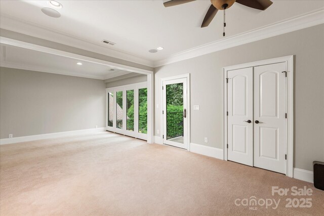 1501 Alydar Ct, Waxhaw, NC 28173 - unfurnished bedroom featuring access to exterior, crown molding, light carpet, baseboards, and recessed lighting
