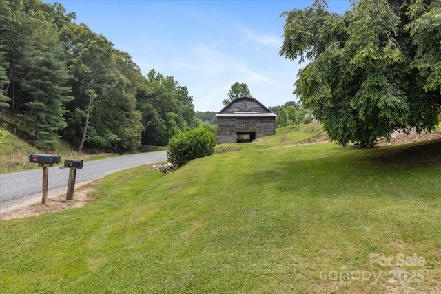 461 Tweed Rd, Madison, NC 28753 - view of green lawn featuring a barn