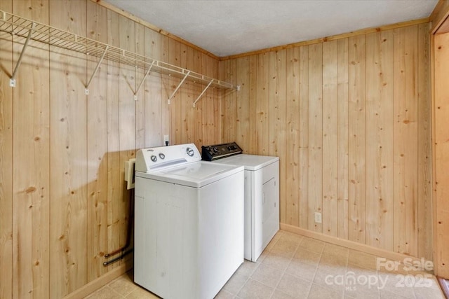 461 Tweed Rd, Madison, NC 28753 - laundry room with washer and clothes dryer and wooden walls