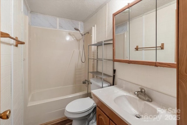 461 Tweed Rd, Madison, NC 28753 - full bath featuring shower / bath combination, vanity, a textured ceiling, tile walls, and tasteful backsplash