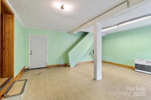 461 Tweed Rd, Madison, NC 28753 - finished below grade area featuring a textured ceiling and baseboards