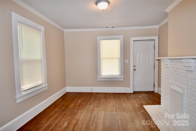2017 Ashley Rd, Charlotte, NC 28208 - unfurnished living room with wood-type flooring and crown molding
