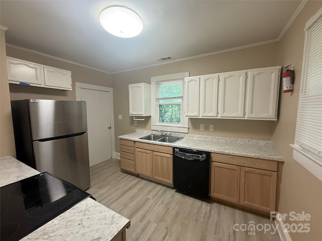 2017 Ashley Rd, Charlotte, NC 28208 - kitchen with black dishwasher, freestanding refrigerator, light wood-style floors, range with electric cooktop, and light countertops