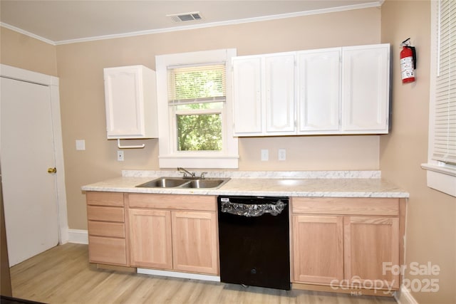 2017 Ashley Rd, Charlotte, NC 28208 - kitchen with dishwasher, light brown cabinetry, light wood finished floors, light countertops, and ornamental molding