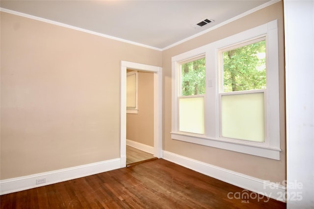 2017 Ashley Rd, Charlotte, NC 28208 - empty room with wood finished floors and ornamental molding