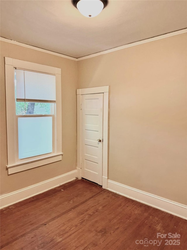 2017 Ashley Rd, Charlotte, NC 28208 - unfurnished room featuring dark wood-type flooring and ornamental molding