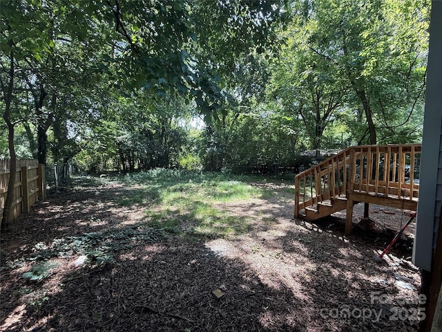 2017 Ashley Rd, Charlotte, NC 28208 - view of yard featuring stairway and a wooden deck