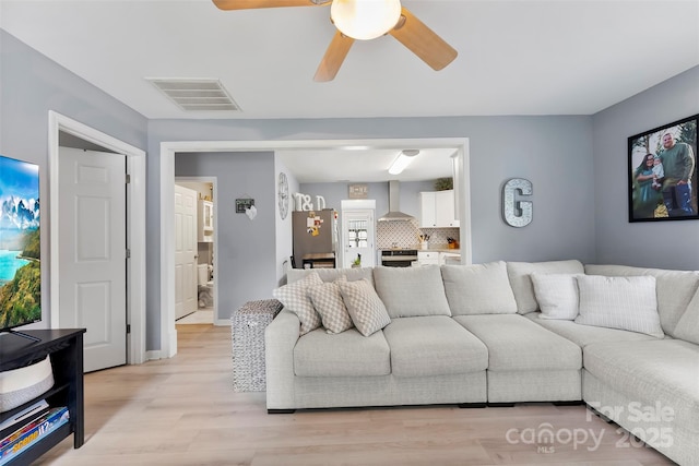 310 S Jacob St, Cherryville, NC 28021 - living room featuring light wood-style floors and a ceiling fan