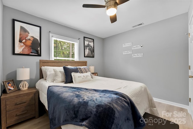 310 S Jacob St, Cherryville, NC 28021 - bedroom featuring wood finished floors, a ceiling fan, and baseboards