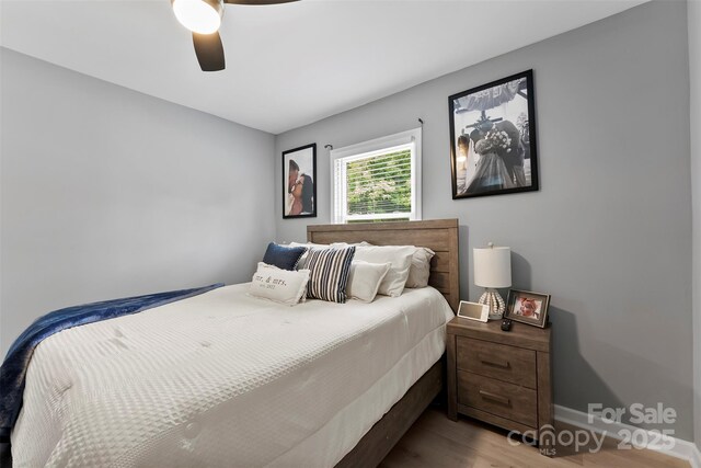 310 S Jacob St, Cherryville, NC 28021 - bedroom with wood finished floors, ceiling fan, and baseboards