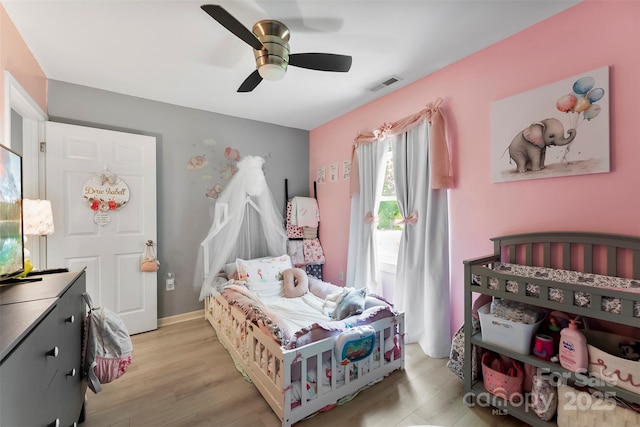 310 S Jacob St, Cherryville, NC 28021 - bedroom featuring light wood-style floors, a ceiling fan, and access to outside