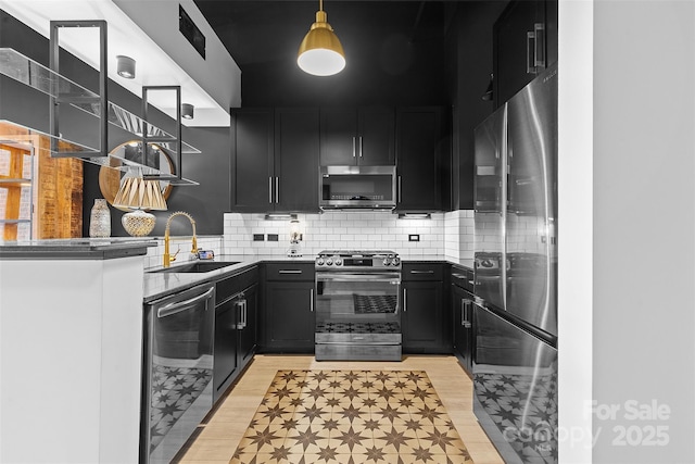 720 Governor Morrison St Unit 219, Charlotte, NC 28211 - kitchen featuring appliances with stainless steel finishes, open shelves, dark cabinetry, light wood finished floors, and decorative backsplash