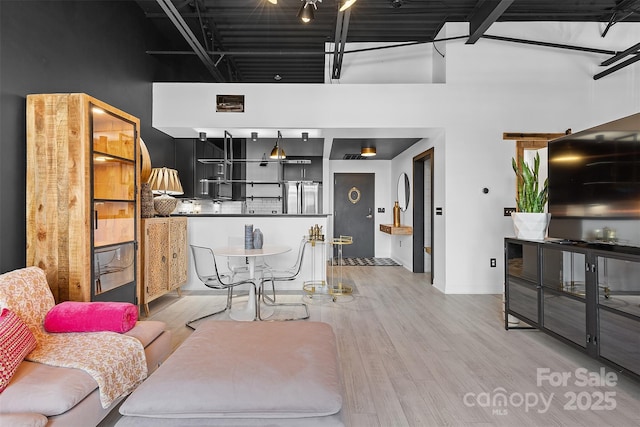 720 Governor Morrison St Unit 219, Charlotte, NC 28211 - living area featuring light wood finished floors and a towering ceiling