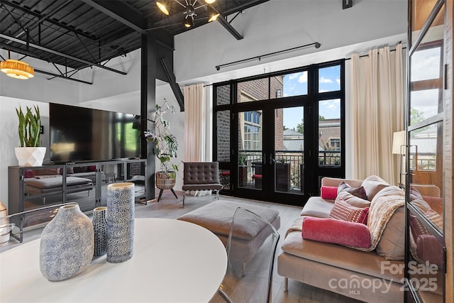 720 Governor Morrison St Unit 219, Charlotte, NC 28211 - living room with a towering ceiling and wood finished floors