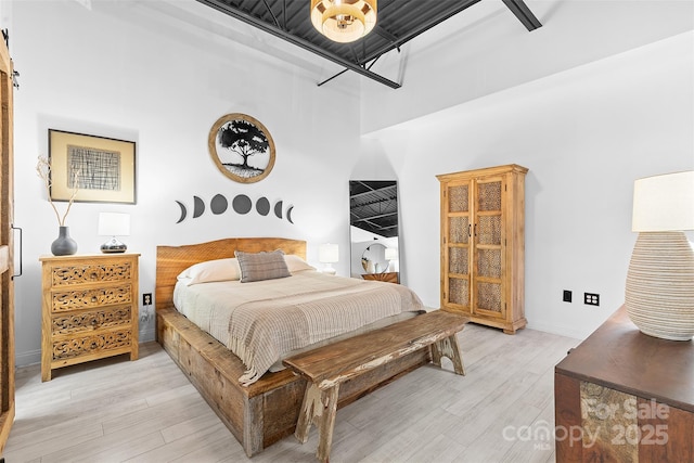 720 Governor Morrison St Unit 219, Charlotte, NC 28211 - bedroom featuring light wood finished floors and a barn door
