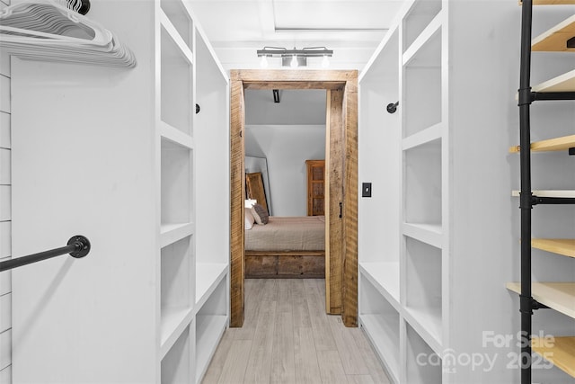 720 Governor Morrison St Unit 219, Charlotte, NC 28211 - walk in closet featuring wood finished floors