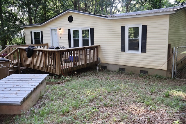 226 Lake Sylvia Rd, Lincolnton, NC 28092 - rear view of house featuring crawl space, a wooden deck, and a metal roof
