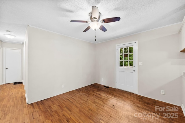 1156 Westover Cir, Rock Hill, SC 29732 - unfurnished room with light wood-style floors, ceiling fan, ornamental molding, a textured ceiling, and a smoke detector