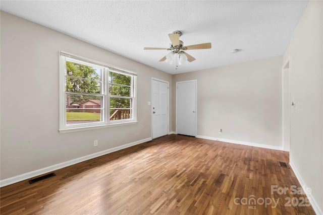 1156 Westover Cir, Rock Hill, SC 29732 - unfurnished room with wood finished floors, ceiling fan, baseboards, and a textured ceiling
