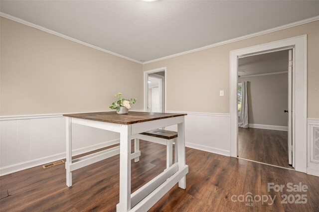 516 Boss Moore Rd, Ellenboro, NC 28040 - unfurnished dining area featuring wood finished floors, crown molding, and baseboards