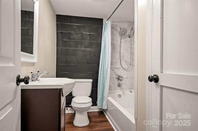 516 Boss Moore Rd, Ellenboro, NC 28040 - bathroom featuring vanity, toilet, shower / bathtub combination with curtain, and wood finished floors