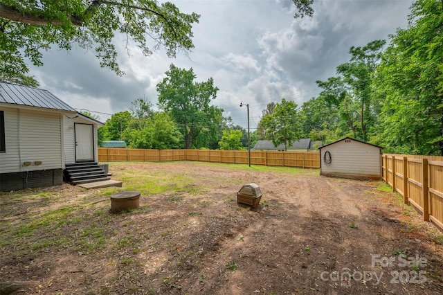 516 Boss Moore Rd, Ellenboro, NC 28040 - fenced backyard featuring entry steps and an outbuilding