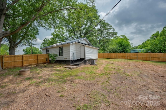 516 Boss Moore Rd, Ellenboro, NC 28040 - rear view of property featuring entry steps, a fenced backyard, and cooling unit