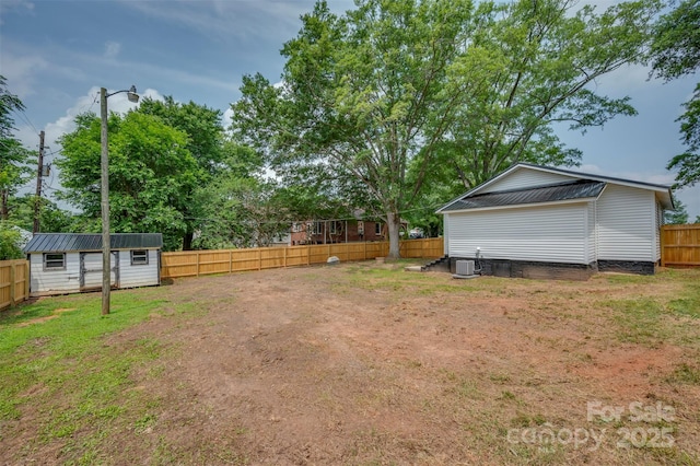 516 Boss Moore Rd, Ellenboro, NC 28040 - view of yard with cooling unit and an outbuilding
