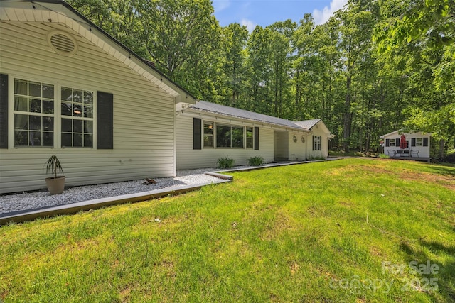 162 Candle St, West Jefferson, NC 28694 - back of property featuring a lawn and metal roof