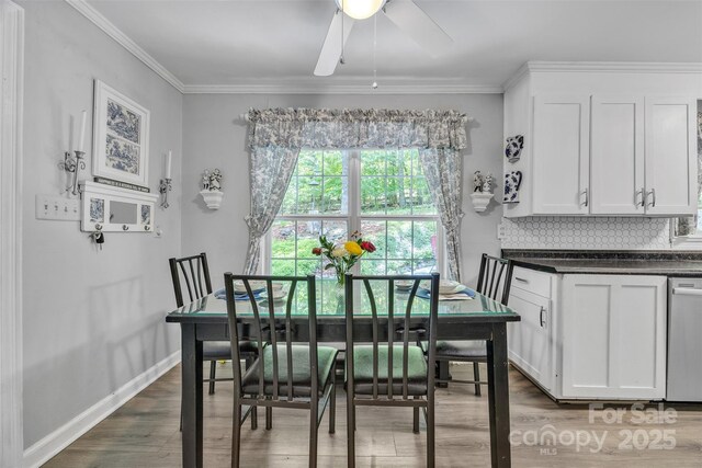 162 Candle St, West Jefferson, NC 28694 - dining area with wood finished floors, ornamental molding, a ceiling fan, and baseboards