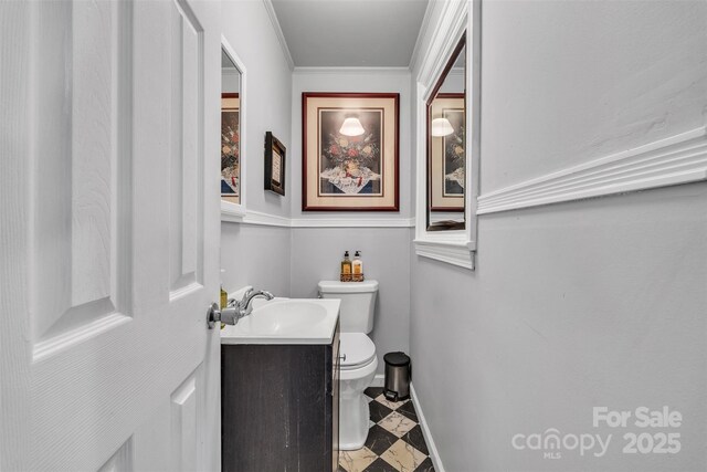 162 Candle St, West Jefferson, NC 28694 - bathroom with toilet, baseboards, vanity, and ornamental molding