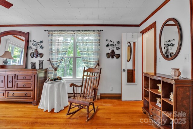 162 Candle St, West Jefferson, NC 28694 - dining space featuring ornamental molding and light wood finished floors