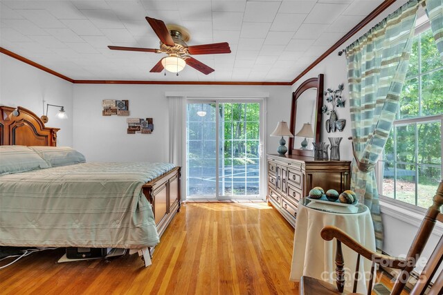 162 Candle St, West Jefferson, NC 28694 - bedroom with ornamental molding, light wood-style flooring, access to exterior, and a ceiling fan