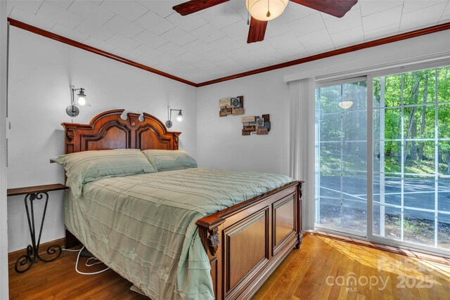 162 Candle St, West Jefferson, NC 28694 - bedroom with wood finished floors, ornamental molding, and a ceiling fan