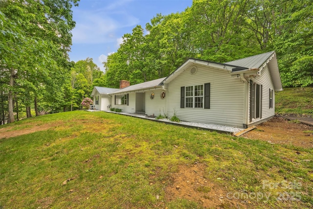 162 Candle St, West Jefferson, NC 28694 - back of property featuring metal roof, a yard, and a chimney