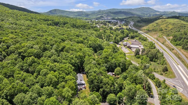 162 Candle St, West Jefferson, NC 28694 - bird's eye view of a heavily wooded area and mountains