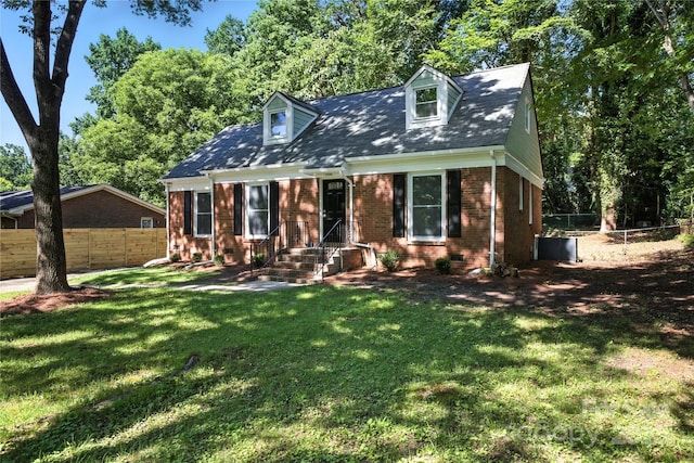 6127 Eagle Peak Dr, Charlotte, NC 28214 - cape cod home with brick siding and view of scattered trees