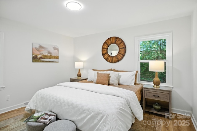 6127 Eagle Peak Dr, Charlotte, NC 28214 - bedroom featuring wood finished floors and baseboards