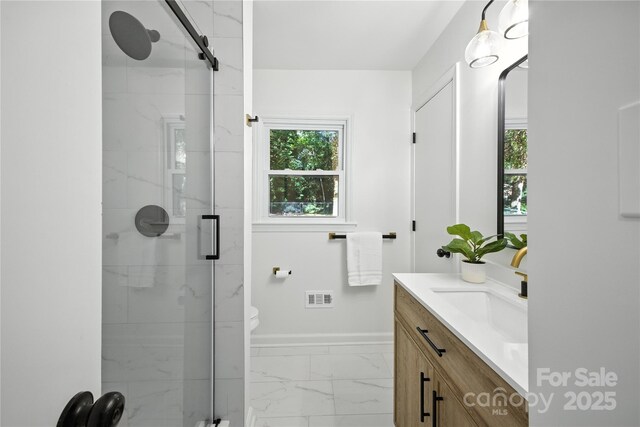 6127 Eagle Peak Dr, Charlotte, NC 28214 - bathroom featuring marble finish floors, vanity, and a shower stall