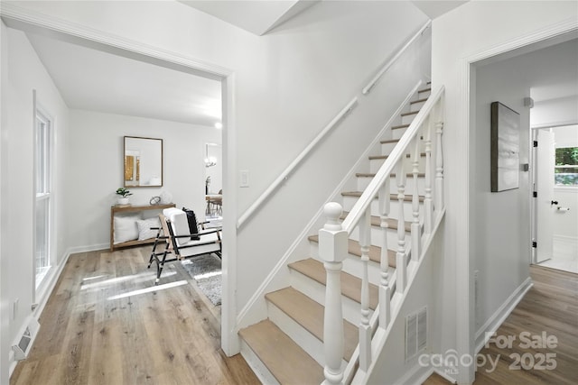 6127 Eagle Peak Dr, Charlotte, NC 28214 - stairs featuring wood finished floors and baseboards