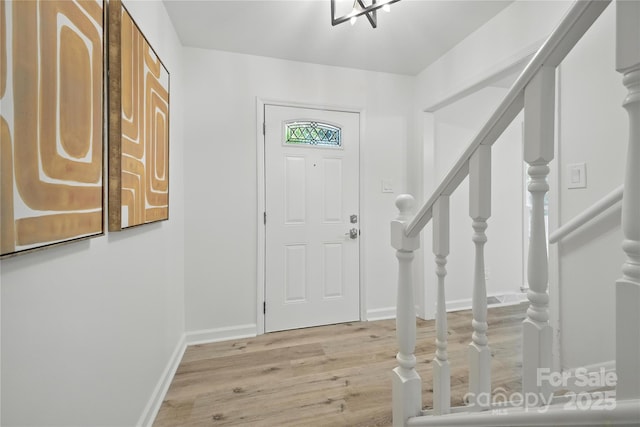 6127 Eagle Peak Dr, Charlotte, NC 28214 - entryway featuring light wood-style floors and stairs