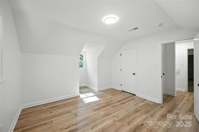 6127 Eagle Peak Dr, Charlotte, NC 28214 - additional living space with vaulted ceiling and light wood-type flooring